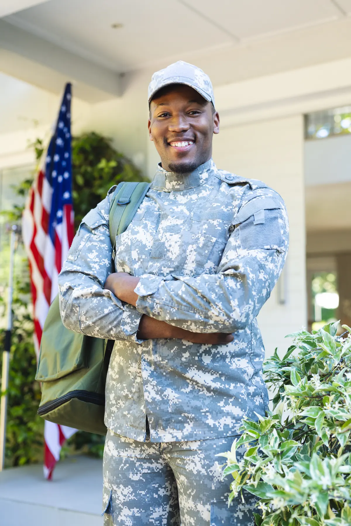 happy-african-american-male-soldier-with-arms-cros-2023-11-29-05-10-49-utc