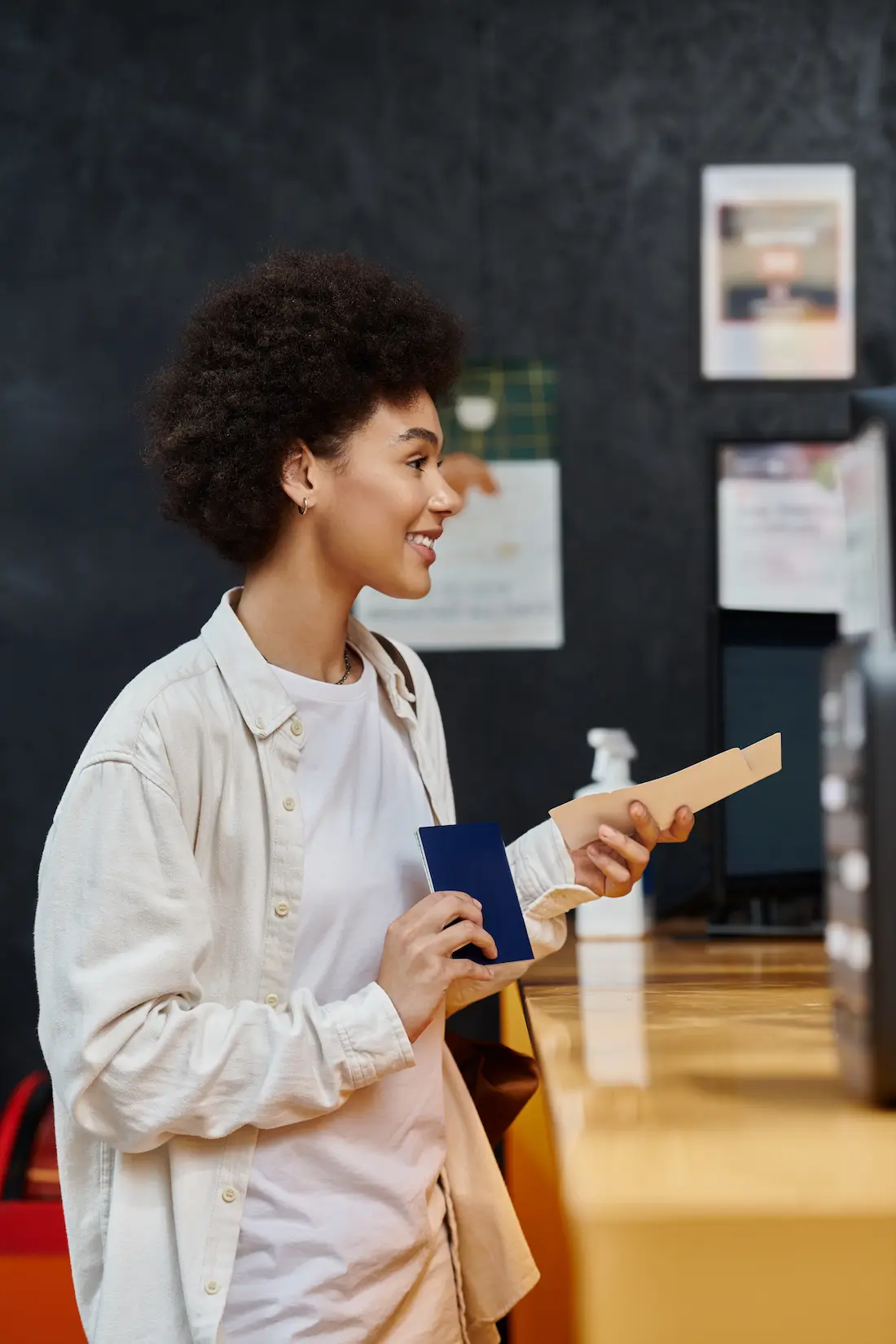 joyful-african-american-woman-checking-in-at-a-coz-2024-11-16-15-45-27-utc